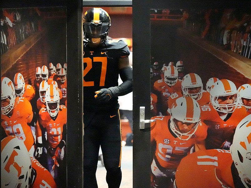 Tennessee defensive lineman James Pearce Jr. (27) walks out of the locker room to start the second half of the NCAA college football game against Kentucky on Saturday, Nov. 2, 2024, in Knoxville, Tenn. (I've been trying to get this photograph of a single player leaving the Tennessee locker room for a few years but it never worked out quite right until James Pearce Jr. showed up)