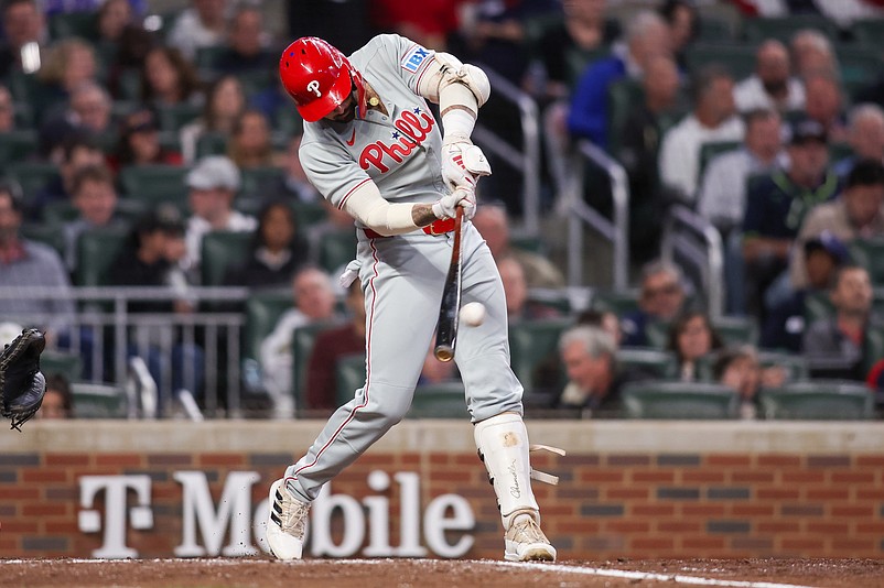 Apr 8, 2025; Atlanta, Georgia, USA; Philadelphia Phillies right fielder Nick Castellanos (8) hits a double against the Atlanta Braves in the fifth inning at Truist Park. Mandatory Credit: Brett Davis-Imagn Images