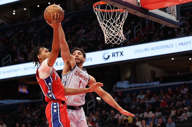 Apr 9, 2025; Washington, District of Columbia, USA; Philadelphia 76ers guard Jeff Dowtin Jr. (11) shoots the ball as Washington Wizards guard Colby Jones (1) defends in the first half at Capital One Arena. Mandatory Credit: Geoff Burke-Imagn Images