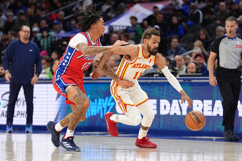 Apr 11, 2025; Philadelphia, Pennsylvania, USA; Atlanta Hawks guard Trae Young (11) drives against Philadelphia 76ers guard Jalen-Hood Schifino (17) in the first quarter at Wells Fargo Center. Mandatory Credit: Kyle Ross-Imagn Images