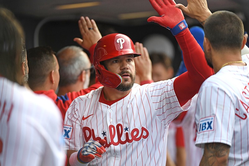 Mar 31, 2025; Philadelphia, Pennsylvania, USA; Philadelphia Phillies designated hitter Kyle Schwarber (12) celebrates his two-run home run in the dugout during the seventh inning against the Colorado Rockies at Citizens Bank Park. Mandatory Credit: Eric Hartline-Imagn Images