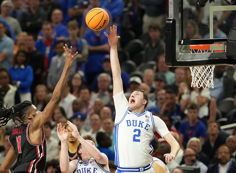 Apr 5, 2025; San Antonio, TX, USA; Duke Blue Devils forward Cooper Flagg (2) and Houston Cougars forward Joseph Tugler (11) battle for the ball in the semifinals of the men's Final Four of the 2025 NCAA Tournament at the Alamodome. Mandatory Credit: Robert Deutsch-Imagn Images