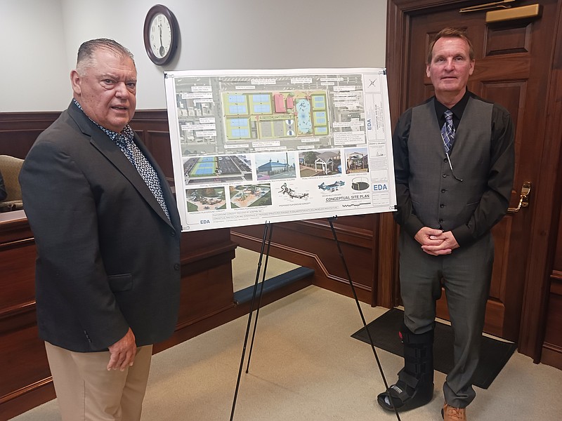 Architect Vince Orlando of Engineering Design Associates and Ocean City Mayor Jay Gillian stand next to a rendering of the 34th Street playground project.