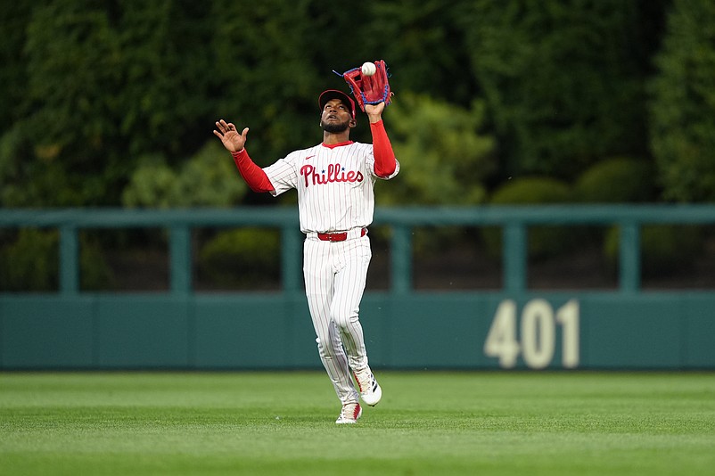 Apr 16, 2025; Philadelphia, Pennsylvania, USA; Philadelphia Phillies outfielder Johan Rojas (23) fields a fly ball against the San Francisco Giants in the second inning at Citizens Bank Park. Mandatory Credit: Kyle Ross-Imagn Images