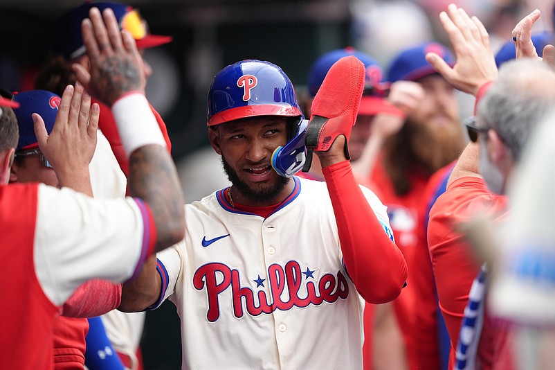 Apr 19, 2025; Philadelphia, Pennsylvania, USA; Philadelphia Phillies outfielder Johan Rojas (23) celebrates with teammates after scoring against the Miami Marlins in the third inning at Citizens Bank Park. Mandatory Credit: Kyle Ross-Imagn Images