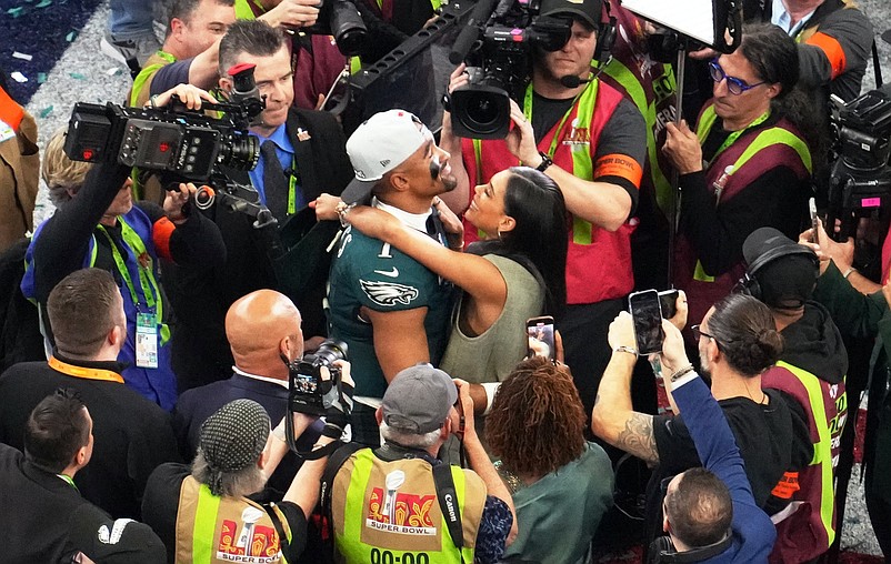 Feb 9, 2025; New Orleans, LA, USA; Philadelphia Eagles quarterback Jalen Hurts (1) reacts with his fiancee Bry Burrows after the Eagles defeated the Chiefs 40-22 in Super Bowl LIX at Caesars Superdome. Mandatory Credit: James Lang-Imagn Images