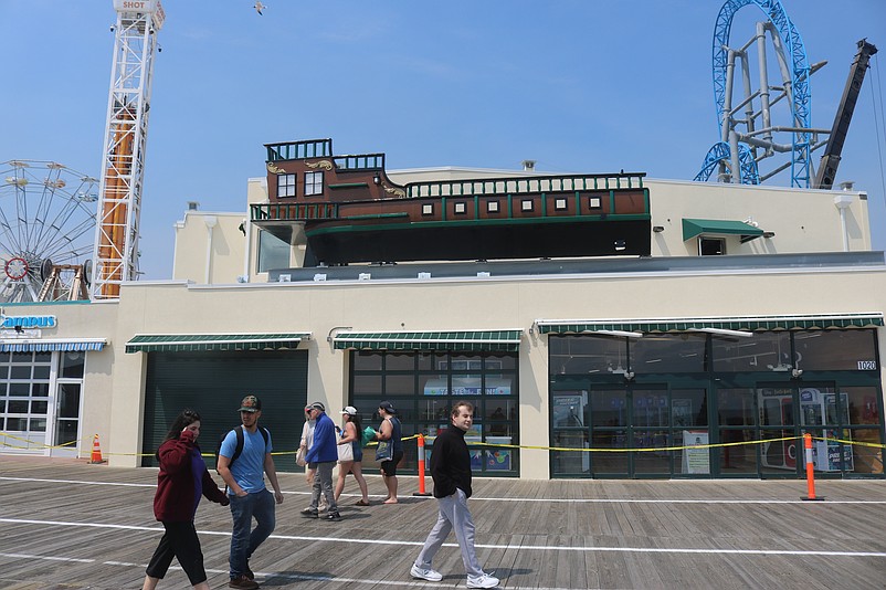 Part of the decorative pirate ship is lifted into place on the roof of Playland's new arcade building on the Boardwalk.