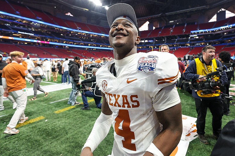 Jan 1, 2025; Atlanta, GA, USA; Texas Longhorns defensive back Andrew Mukuba (4) celebrates after a victory over the Arizona State Sun Devils in the Peach Bowl at Mercedes-Benz Stadium. Mandatory Credit: Brett Davis-Imagn Images