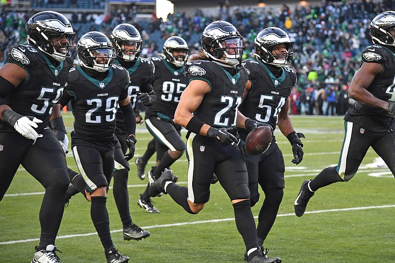 Jan 5, 2025; Philadelphia, Pennsylvania, USA; Philadelphia Eagles safety Sydney Brown (21) celebrates his interception with teammates against the New York Giants  during the fourth quarter at Lincoln Financial Field. Mandatory Credit: Eric Hartline-Imagn Images
