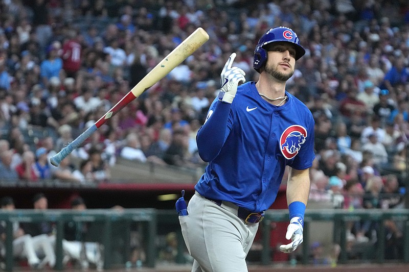 Mar 29, 2025; Phoenix, Arizona, USA; Chicago Cubs outfielder Kyle Tucker (30) hits a two-run home run against the Arizona Diamondbacks in the fifth inning at Chase Field. Mandatory Credit: Rick Scuteri-Imagn Images