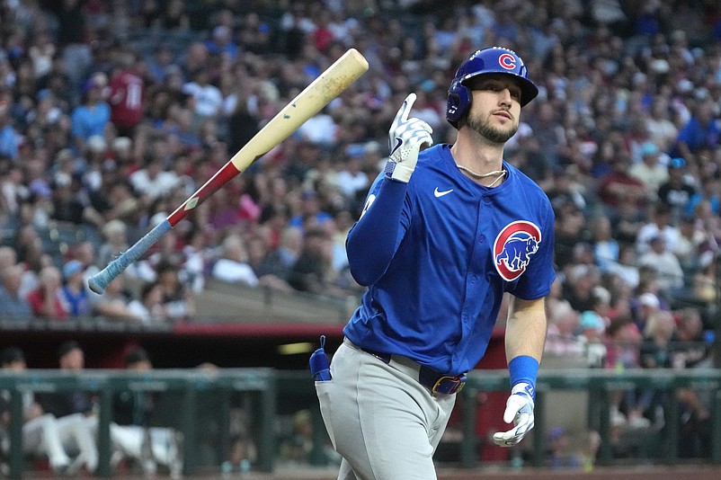 Mar 29, 2025; Phoenix, Arizona, USA; Chicago Cubs outfielder Kyle Tucker (30) hits a two-run home run against the Arizona Diamondbacks in the fifth inning at Chase Field. Mandatory Credit: Rick Scuteri-Imagn Images