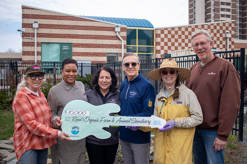 Margate restauranteur Cookie Till, left, accepts a $10,000 donation from Hard Rock to sustain a farm-to-table program at the Boys and Girls Club of Atlantic City.