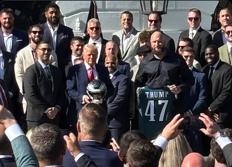 Nick Sirianni and Lane Johnson present President Trump with an autographed Eagles helmet and a personalized Eagles jersey at the White house on Monday. (Credit: John Clark [@JClarkNBCS] on X)