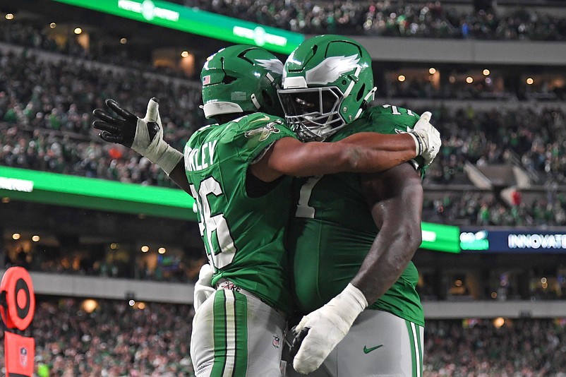 Nov 3, 2024; Philadelphia, Pennsylvania, USA; Philadelphia Eagles running back Saquon Barkley (26) celebrates his touchdown run with offensive tackle Mekhi Becton (77) during the second quarter against the Jacksonville Jaguars at Lincoln Financial Field. Mandatory Credit: Eric Hartline-Imagn Images