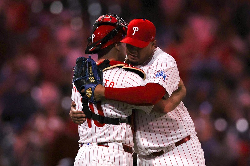 Apr 30, 2025; Philadelphia, Pennsylvania, USA; Philadelphia Phillies pitcher Carlos Hernandez (35) and catcher J.T. Realmuto (10) congratulate each other after a victory against the Washington Nationals at Citizens Bank Park. Mandatory Credit: Bill Streicher-Imagn Images