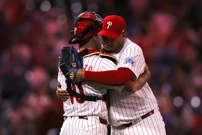 Apr 30, 2025; Philadelphia, Pennsylvania, USA; Philadelphia Phillies pitcher Carlos Hernandez (35) and catcher J.T. Realmuto (10) congratulate each other after a victory against the Washington Nationals at Citizens Bank Park. Mandatory Credit: Bill Streicher-Imagn Images