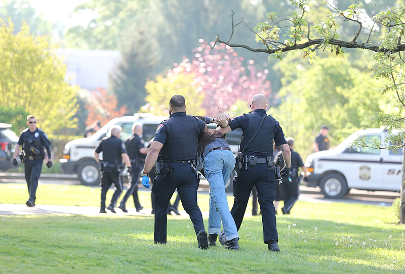 Police arrest a protestor on the campus of Swarthmore College on Saturday morning. (Credit: Zack Kreines for the Swarthmore Phoenix)