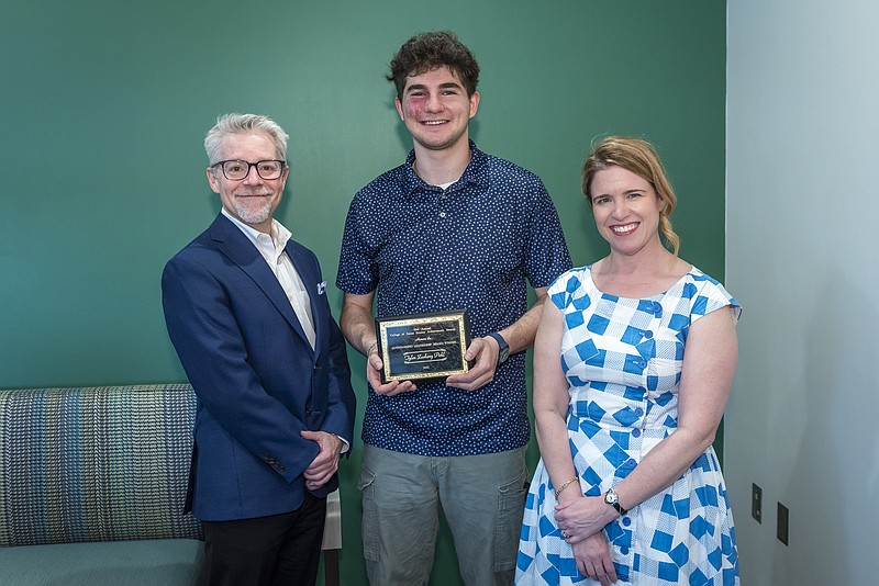 Dean Brent Donnellan, Tyler Pohl, Associate Dean Emily Durbin. Pohl received the Outstanding Leadership Award and was a student in the Department of Political Science. (Credit: Michigan State University).