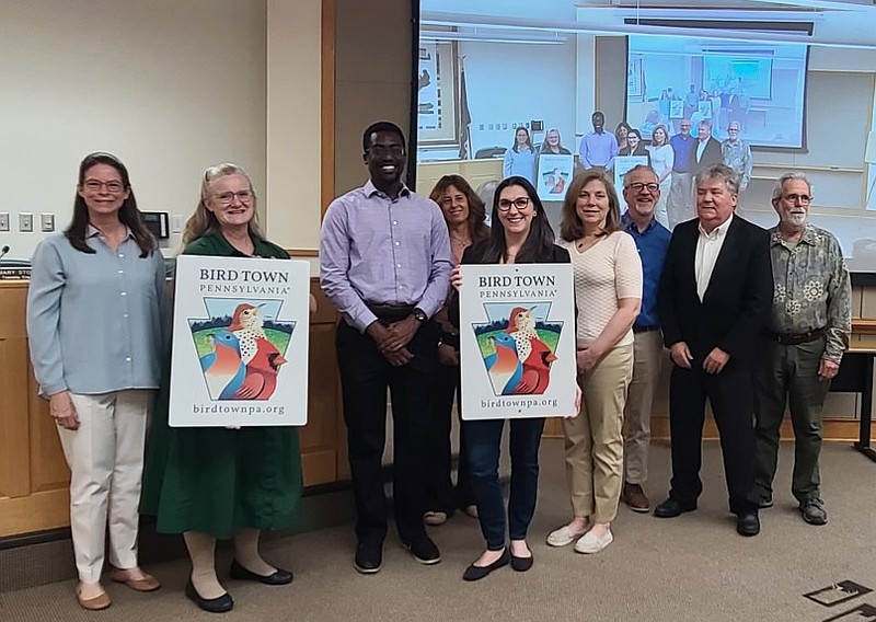 Members of Towamencin’s board of supervisors and Bird Town committee pose with signs indicating the town’s recently awarded status as a Bird Town. From left to right are Heidi Shiver, President of Bird Town Pennsylvania; supervisors Joyce Snyder, Kofi Osei and Kristin Warner; township bird town committee members Vanessa Gaynor, Donna Hegge, and Andrew Dolan; supervisors Chairman Chuck Wilson and bird town committee member Bruce Bailey.