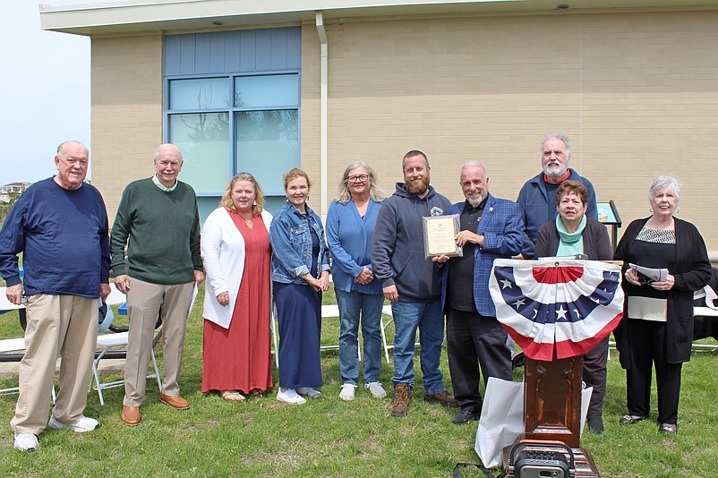 Public Works Employee Nick Bednarek, sixth from left, receives Sea Isle City's "Green Thumb Award" from Mayor Leonard Desiderio, holding plaque. (Photo courtesy of Sea Isle City)