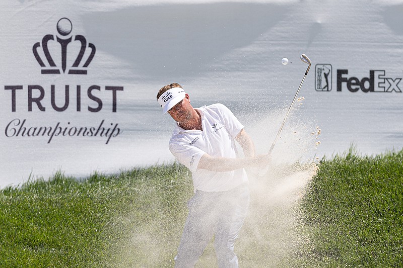 May 8, 2025; Philadelphia, Pennsylvania, USA; Keith Mitchell plays his shot from a bunker on the 16th hole during the first round of the Truist Championship golf tournament. Mandatory Credit: Bill Streicher-Imagn Images