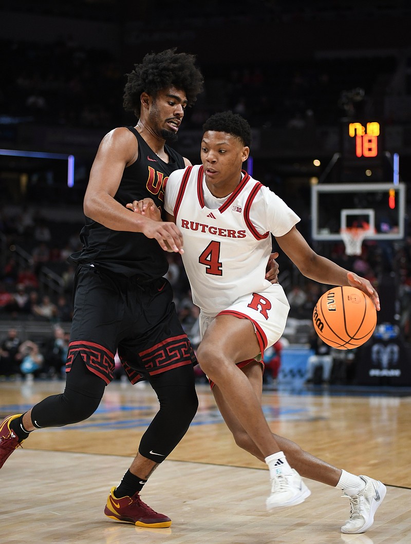 Mar 12, 2025; Indianapolis, IN, USA; Rutgers Scarlet Knights guard Ace Bailey (4) goes to the basket against USC Trojans forward Saint Thomas (0) during the first half at Gainbridge Fieldhouse. Mandatory Credit: Robert Goddin-Imagn Images