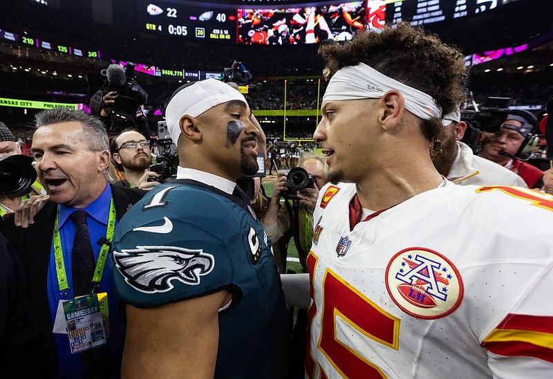 Feb 9, 2025; New Orleans, LA, USA; Philadelphia Eagles quarterback Jalen Hurts (1) greets Kansas City Chiefs quarterback Patrick Mahomes (15) following Super Bowl LIX at Ceasars Superdome. Mandatory Credit: Mark J. Rebilas-Imagn Images