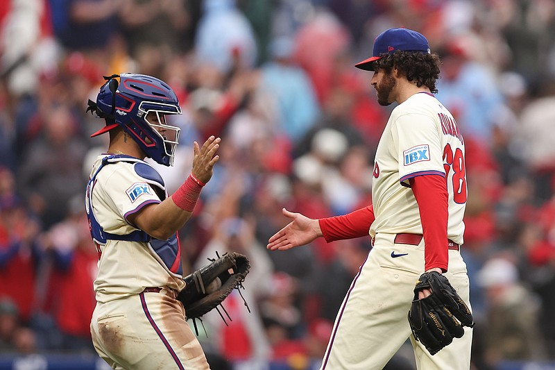 May 14, 2025; Philadelphia, Pennsylvania, USA; Philadelphia Phillies pitcher Jordan Romano (68) and catcher Rafael Marchan (13) shake hands after a victory against the St. Louis Cardinals at Citizens Bank Park. Mandatory Credit: Bill Streicher-Imagn Images