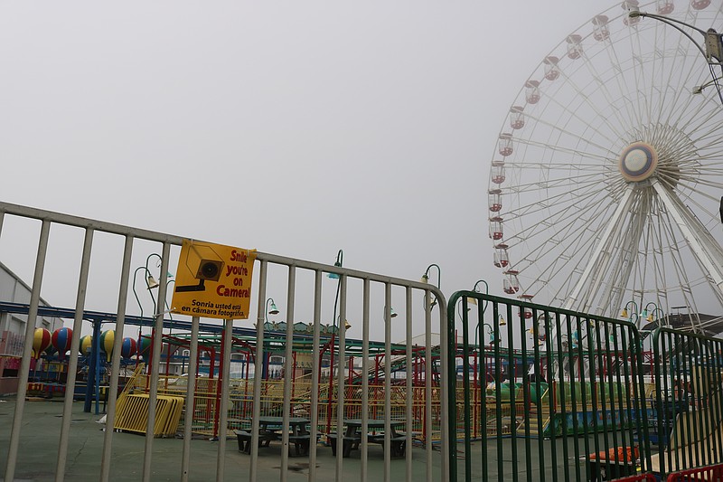 The Ferris wheel and other Wonderland Pier rides are now closed off to the public behind a locked gate.
