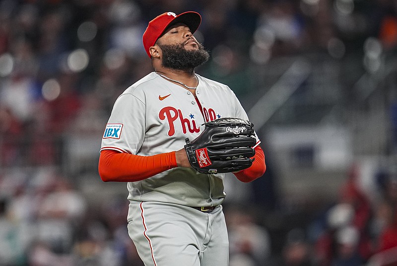 Apr 9, 2025; Cumberland, Georgia, USA; Philadelphia Phillies pitcher Jose Alvarado (46) reacts after retiring the side against the Atlanta Braves during the eighth inning at Truist Park. Mandatory Credit: Dale Zanine-Imagn Images