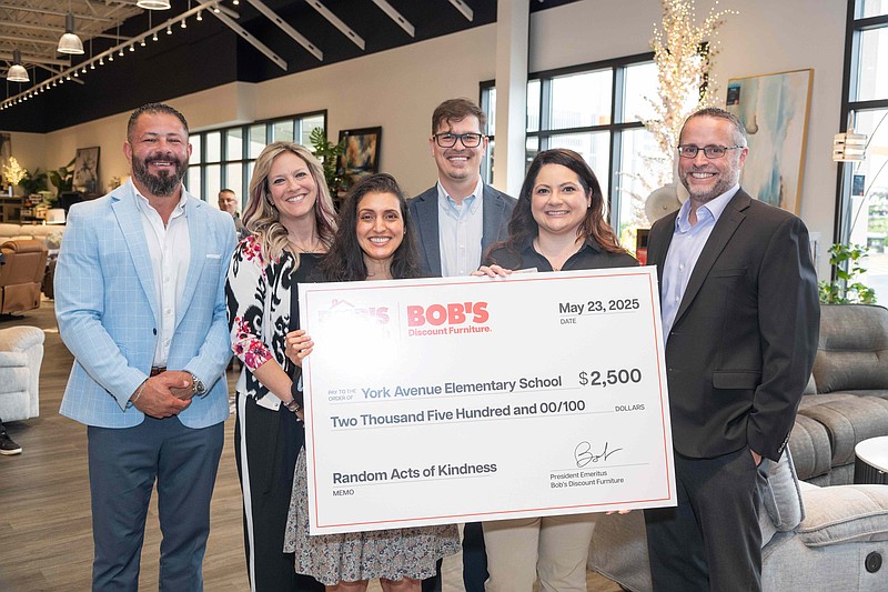Bob’s Discount Furniture presented a $2,500 Random Acts of Kindness donation to York Avenue Elementary School, representing their commitment to supporting local schools. Principal Dipa Richardson (left, center) accepted the donation from Bob’s store manager, Amanda Daniel (left, center). Also pictured left to right: Adam Abbassi, Divisional Vice President; Kalen Wika, Store Manager; Josh Jones, Regional Sales Director; and Chuck James, Senior Vice President Retail Operations. (Credit: Bob's Discount Furniture)