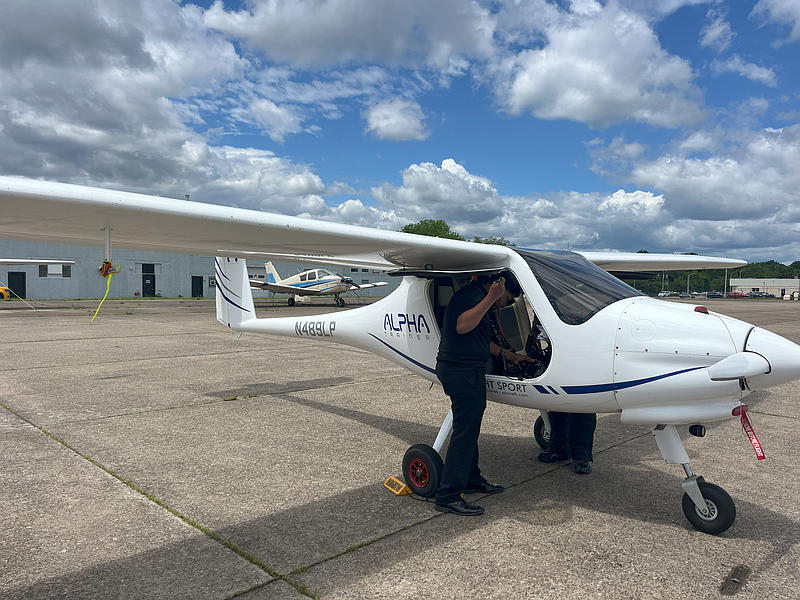 Jonathan Suarez preparing one of Tailwind Aviation Academy's five airplanes for takeoff. (CREDIT: Madeline Bader)