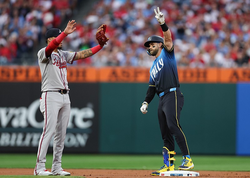 Aug 30, 2024; Philadelphia, Pennsylvania, USA; Philadelphia Phillies first base Bryce Harper (3) reacts in front of Atlanta Braves shortstop Orlando Arcia (11) after his double during the first inning at Citizens Bank Park. Mandatory Credit: Bill Streicher-USA TODAY Sports