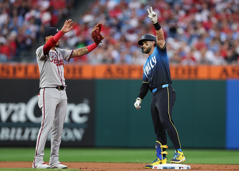 Aug 30, 2024; Philadelphia, Pennsylvania, USA; Philadelphia Phillies first base Bryce Harper (3) reacts in front of Atlanta Braves shortstop Orlando Arcia (11) after his double during the first inning at Citizens Bank Park. Mandatory Credit: Bill Streicher-USA TODAY Sports