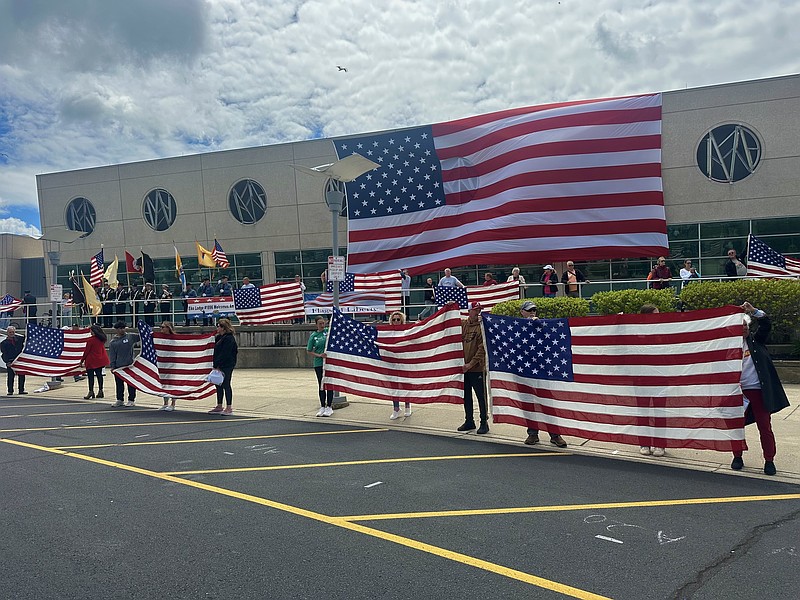 Flags are unfurled in tribute to deceased military veterans during the Flags of Liberty ceremony. (Photo courtesy of the Greater Wildwoods Tourism Improvement & Development Authority)