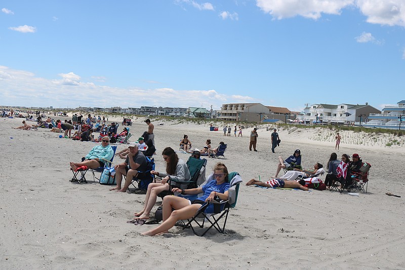 Sea Isle City beachgoers find a favorite spot to relax on the sand during the Memorial Day weekend.