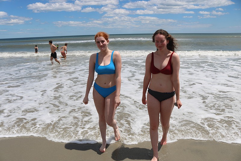 Cousins Nora Weiner and Ally Sibole are brave enough to venture into the chilly water.