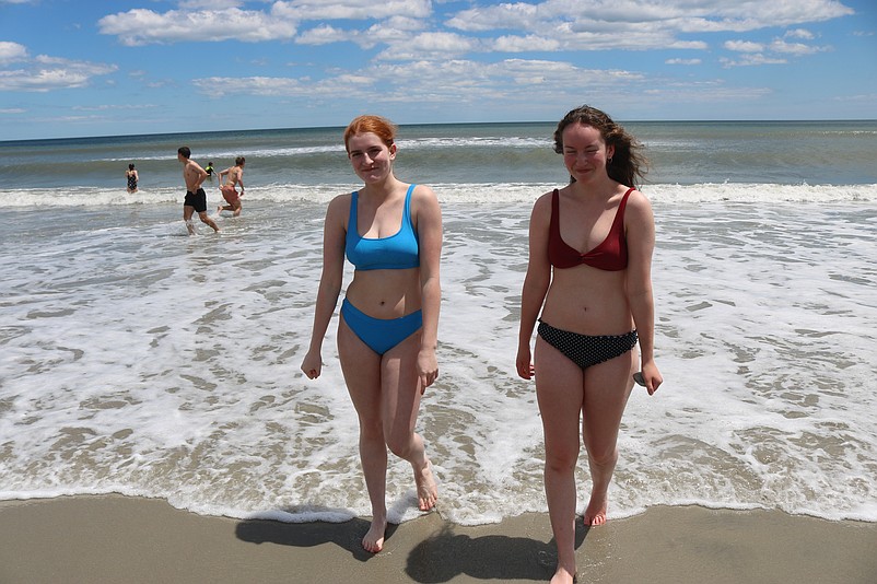 Cousins Nora Weiner and Ally Sibole are brave enough to venture into the chilly water.
