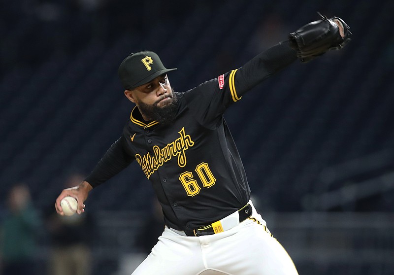 Apr 14, 2025; Pittsburgh, Pennsylvania, USA; Pittsburgh Pirates relief pitcher Dennis Santana (60) pitches against the Washington Nationals during the ninth inning at PNC Park. Mandatory Credit: Charles LeClaire-Imagn Images