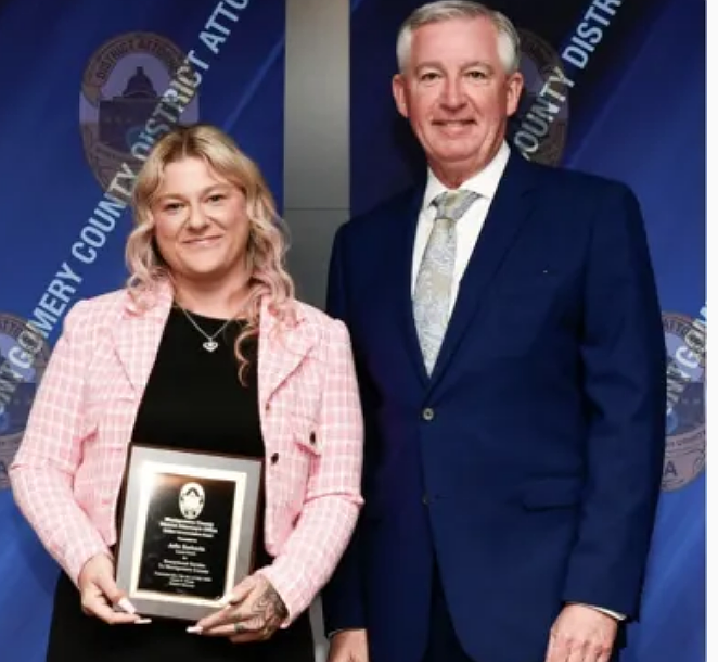 Julie Barberio, member of Laurel House Domestic Abuse Response Team, receives a civilian commendation from Montgomery County District Attorney Kevin R. Steele. (Credit: Montgomery County District Attorney’s Office)
