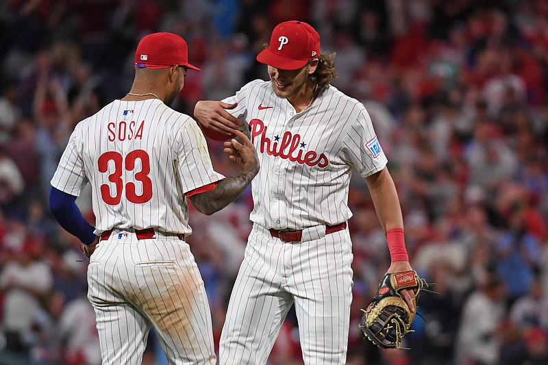 May 27, 2025; Philadelphia, Pennsylvania, USA; Philadelphia Phillies second base Edmundo Sosa (33) and third base Alec Bohm (28) celebrate win against the Atlanta Braves at Citizens Bank Park. Mandatory Credit: Eric Hartline-Imagn Images