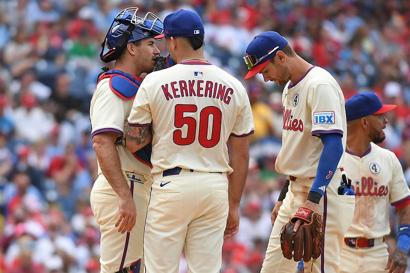 Jun 1, 2025; Philadelphia, Pennsylvania, USA; Philadelphia Phillies catcher J.T. Realmuto (10), pitcher Orion Kerkering (50) and shortstop Trea Turner (7) on the mound during the seventh inning against the Milwaukee Brewers at Citizens Bank Park. Mandatory Credit: Eric Hartline-Imagn Images
