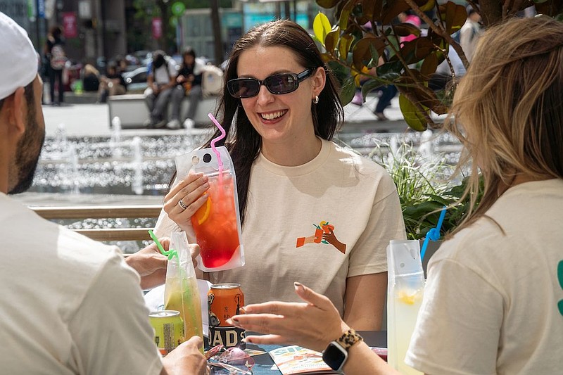 A group celebrating SIPS in Center City sporting SIPS merchandise. (Credit: Center City District)