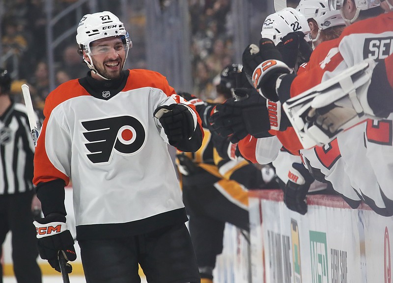 Feb 27, 2025; Pittsburgh, Pennsylvania, USA;  Philadelphia Flyers left wing Noah Cates (27) celebrates with the Flyers bench after scoring a goal against the Pittsburgh Penguins during the first period at PPG Paints Arena. Mandatory Credit: Charles LeClaire-Imagn Images