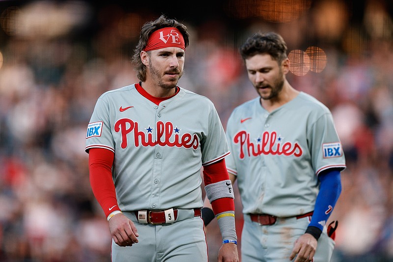 May 20, 2025; Denver, Colorado, USA; Philadelphia Phillies second baseman Bryson Stott (5) and shortstop Trea Turner (7) in the fourth inning against the Colorado Rockies at Coors Field. Mandatory Credit: Isaiah J. Downing-Imagn Images