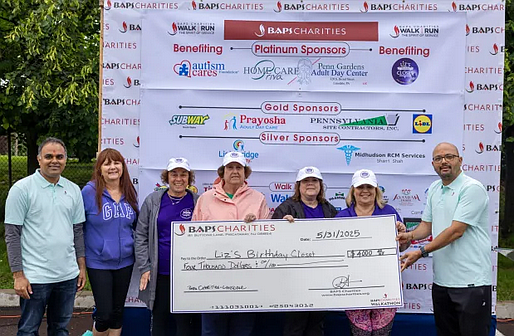 BAPS Charities in Lansdale presents a $4,000 check to Liz’s Birthday Closet. (Credit: Gopin Patel)