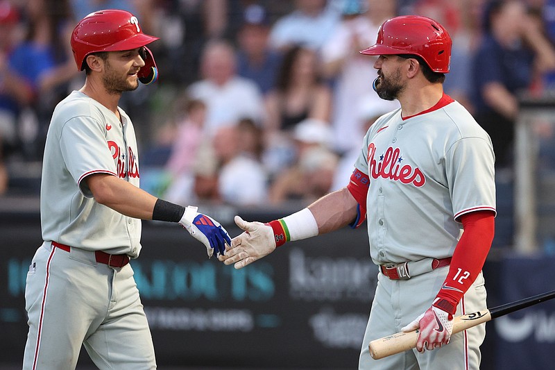 May 7, 2025; Tampa, Florida, USA; Philadelphia Phillies shortstop Trea Turner (7) reacts withdesignated hitter Kyle Schwarber (12) after hitting a home run against the Tampa Bay Rays in the third inning at George M. Steinbrenner Field. Mandatory Credit: Nathan Ray Seebeck-Imagn Images