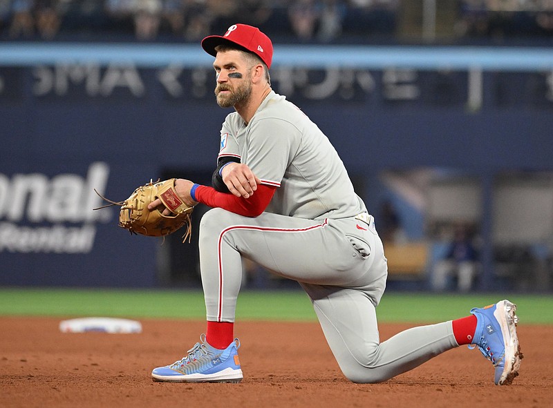 Jun 4, 2025; Toronto, Ontario, CAN;  Philadelphia Phillies first baseman Bryce Harper (3) looks on during an injury delay in the ninth inning against the Toronto Blue Jays at Rogers Centre. Mandatory Credit: Dan Hamilton-Imagn Images
