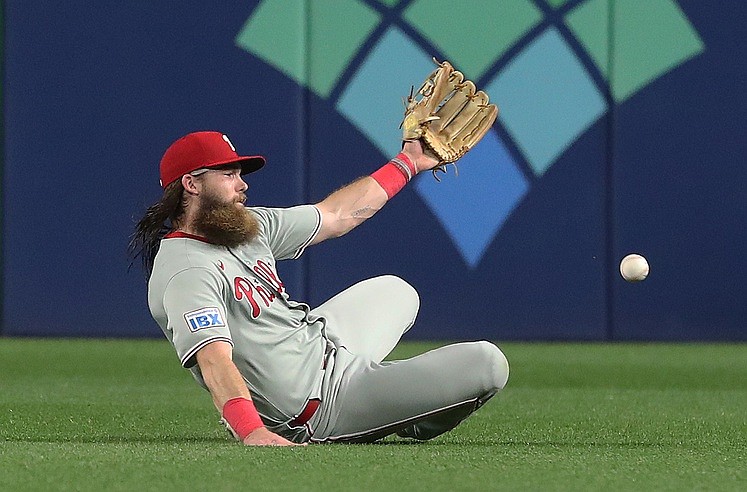 Jun 6, 2025; Pittsburgh, Pennsylvania, USA;  Philadelphia Phillies center fielder Brandon Marsh (16) can not catch a ball hit for a single by Pittsburgh Pirates third baseman Jared Triolo (not pictured) during the ninth inning at PNC Park. Mandatory Credit: Charles LeClaire-Imagn Images