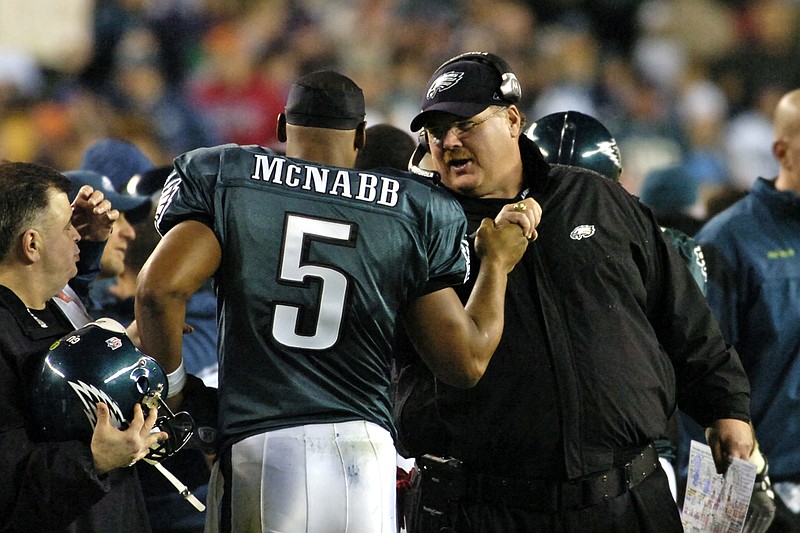 December 15, 2008; Philadelphia, PA USA; Philadelphia Eagles quarterback Donovan McNabb (5) is congratulated from head coach Andy Reid after McNabb threw touchdown pass in fourth quarter of the 30-10 win over the Cleveland Browns at Lincoln Financial Field. Mandatory Credit: Eric Hartline-USA TODAY Sports